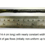 Fig. 6 Si crystal (~14.4 cm long) with nearly constant width grown by proper adjustment of gas flows (initially non-uniform up to 1.5 cm)